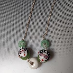 Geisha beads carved jade balls on a silver chain necklace